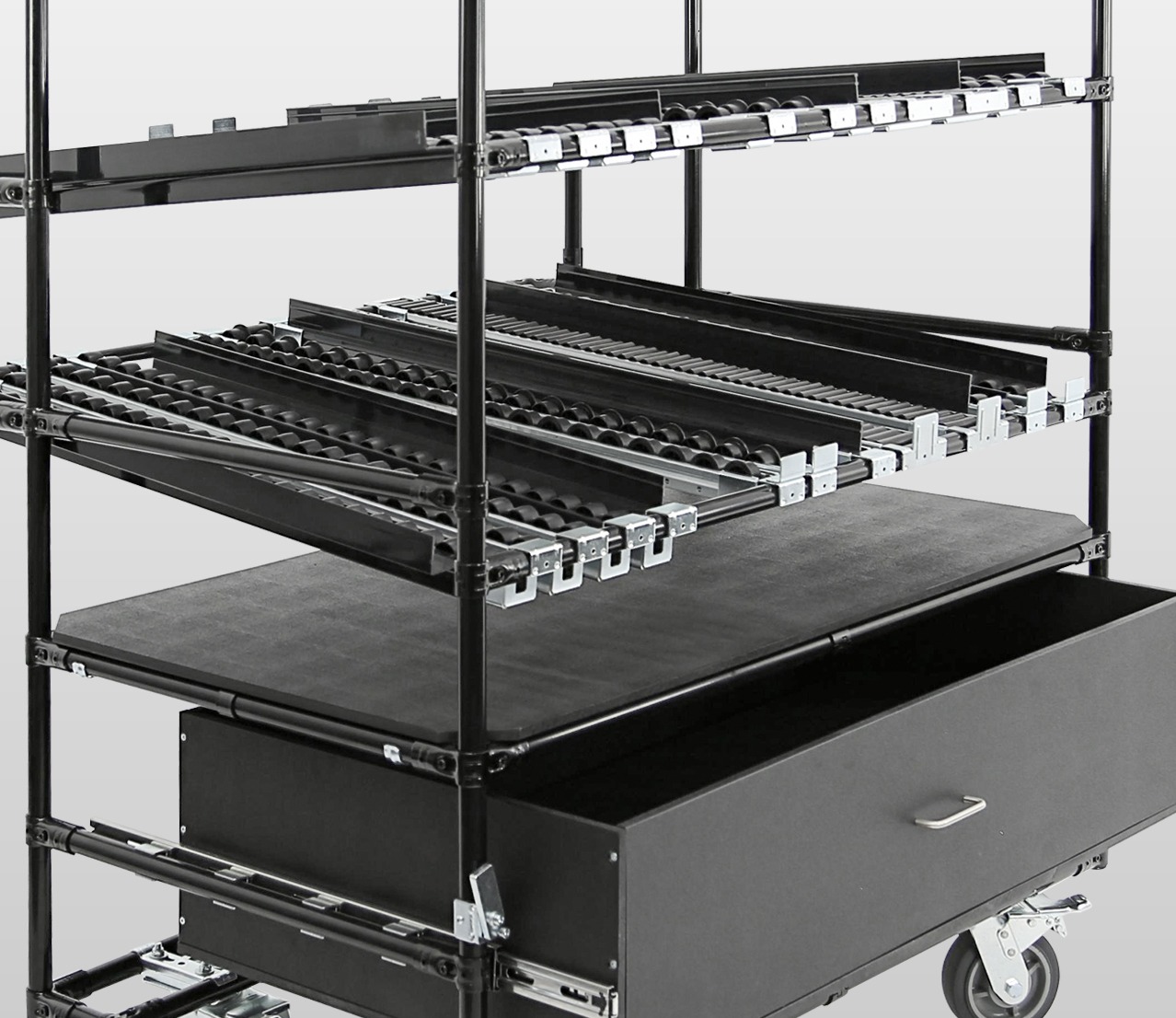 Gravity flow rack cart with roller tracks, storage drawer, and pipe and joint framing designed for lean manufacturing, FIFO inventory management, and material handling applications.