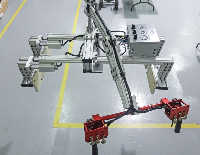 Custom robotic end-of-arm tooling (EOAT) built with 80/20 T-slot aluminum profiles for automated material handling, pick-and-place operations, and industrial manufacturing.