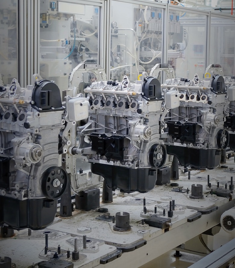 Automotive manufacturing banner showing material handling, workstations, guarding, and machine framing applications.