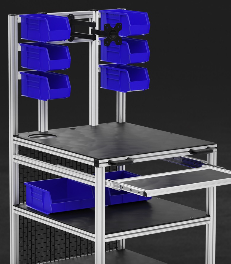 Modular Industrial Workstation with Adjustable Storage Bins A modular industrial workstation made from aluminum framing, featuring a black work surface, multiple blue plastic storage bins mounted on vertical supports, a sliding shelf, and additional lower storage areas.