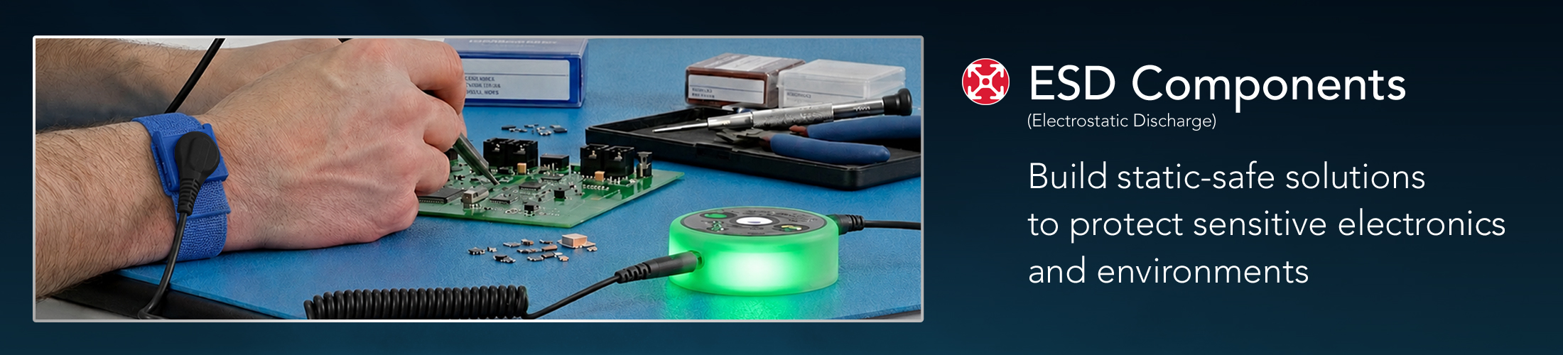 Technician using ESD-safe components, including a grounding wrist strap and ionizing blower, at an electronics workstation to protect sensitive electronic devices from electrostatic discharge (ESD).