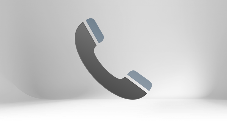 A 3D stylized red and grey telephone handset icon tilted on a dark grey gradient background. The graphic represents direct phone support and sales consultation for 80/20 T-slot aluminum framing projects.