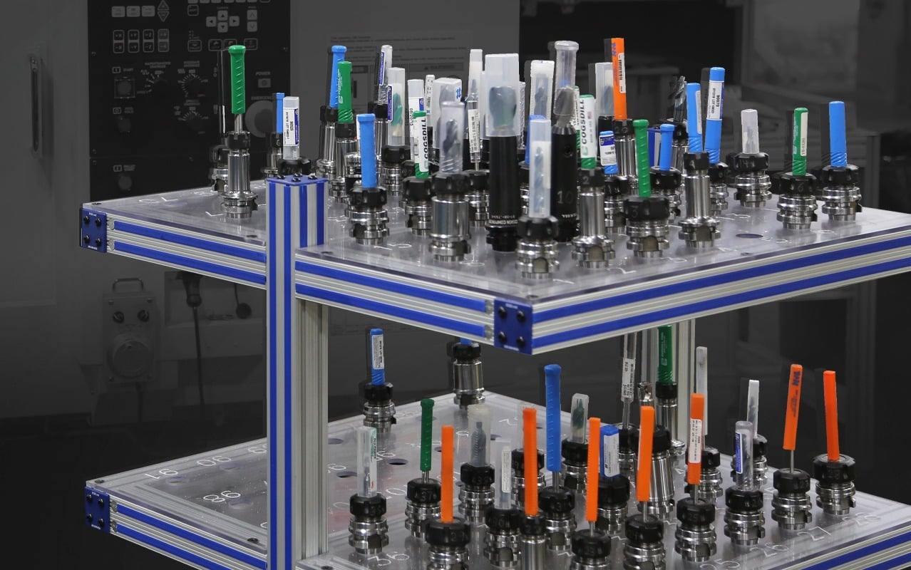 Industrial CNC tool storage cart with organized tool holders, cutting tools, and aluminum extrusion framing designed for tool management, production efficiency, and manufacturing operations.