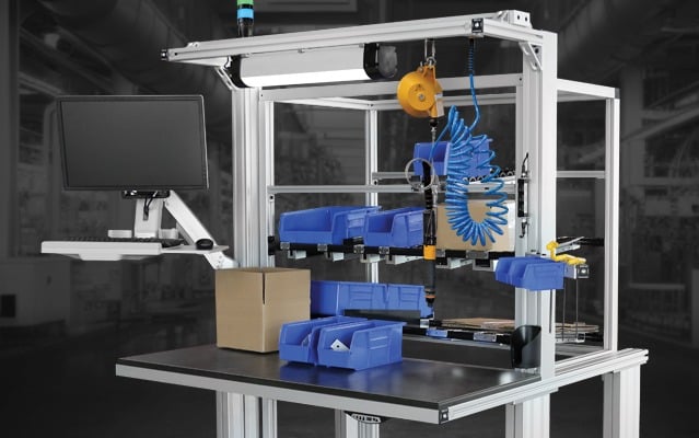 Industrial Assembly Workstation with Parts Kitting and Ergonomic Tool Support Industrial assembly workstation featuring parts bins, monitor mount, tool balancer, pneumatic tools, and aluminum extrusion framing designed for efficient manufacturing, kitting, and assembly operations.
