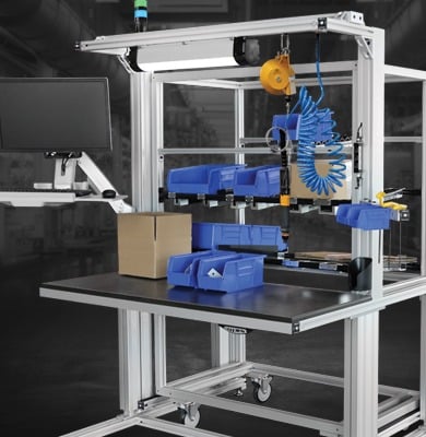 Industrial Assembly Workstation with Parts Kitting and Ergonomic Tool Support Industrial assembly workstation featuring parts bins, monitor mount, tool balancer, pneumatic tools, and aluminum extrusion framing designed for efficient manufacturing, kitting, and assembly operations.