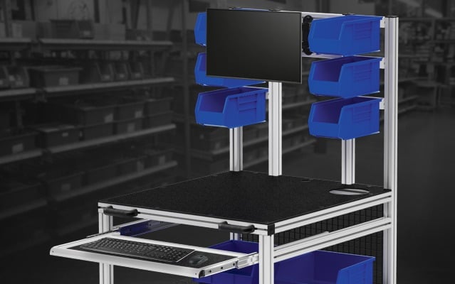 Material Handling Workstation with Parts Storage Bins and Monitor Mount Material handling workstation featuring overhead storage bins, monitor mount, keyboard tray, and aluminum extrusion framing for inventory management, order fulfillment, and production support.