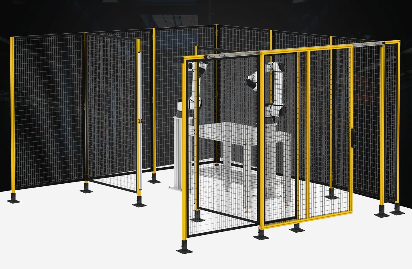 Industrial robot arm workstation enclosed by a yellow and black T-slot aluminum safety cage with wire mesh panels for machine guarding.