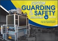Front cover of the 80/20 Custom Guarding and Safety Solutions booklet, featuring an industrial machine enclosure built with T-slot aluminum framing and black protective panels in a factory setting.