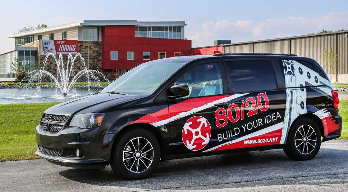 80/20 branded mobile demonstration van outside company headquarters providing industrial product support and T-slot aluminum solution demonstrations.