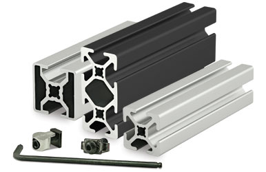 A collection of aluminum extrusion profiles in various shapes and sizes, along with fastening hardware.
