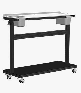 Mobile utility table in black with a long basin and lower shelf, set on caster wheels for easy transportation, against a white background.