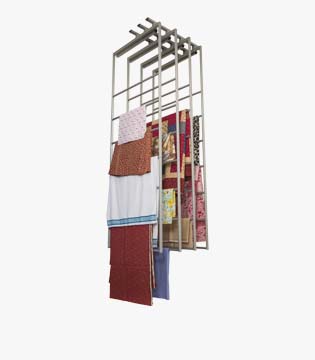 Vertical storage rack with sliding bars, displaying hanging textiles and magazines, isolated on a white background.