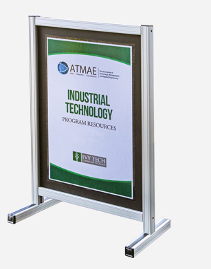 Freestanding aluminum frame display with a sign for 'ATMAE Industrial Technology Program Resources' by Ivy Tech.