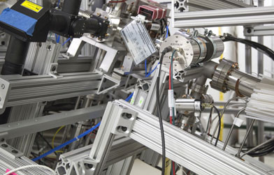 Complex aluminum extrusion assembly with various automation components and electronic devices.