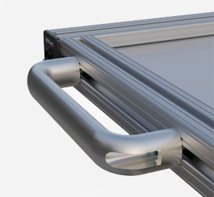Metallic rail with attached curved handle for equipment operation.